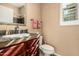 Bathroom with a single vanity, wood cabinets, and tile countertops at 28798 N 127Th Ave, Peoria, AZ 85383