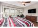 Bedroom with a desk and a large window with blinds at 28798 N 127Th Ave, Peoria, AZ 85383
