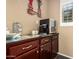 Counter with dark wood cabinets and a coffee machine at 28798 N 127Th Ave, Peoria, AZ 85383