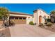 Single-story home with a desert landscape, brick driveway and a two car garage at 28798 N 127Th Ave, Peoria, AZ 85383