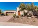 Charming single-story home with a well-manicured front yard, desert landscaping and a two car garage at 28798 N 127Th Ave, Peoria, AZ 85383