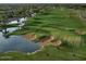 Aerial view of lush green golf course with water features and sand traps at 28798 N 127Th Ave, Peoria, AZ 85383