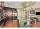 Open concept kitchen with a spacious island, stainless steel appliances, and seamless flow into the adjacent living area at 28798 N 127Th Ave, Peoria, AZ 85383