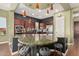 Gourmet kitchen featuring a large island with seating, stainless steel appliances, and stylish pendant lighting at 28798 N 127Th Ave, Peoria, AZ 85383