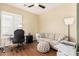 This home office is highlighted by wood-look floors and a neutral color palette at 28798 N 127Th Ave, Peoria, AZ 85383