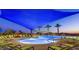 Inviting community pool with ample lounge chairs and shade structures for relaxation at 28798 N 127Th Ave, Peoria, AZ 85383