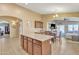 Well-appointed kitchen with island and seamless transitions to living and dining spaces at 2910 E Quiet Hollow Ln, Phoenix, AZ 85024