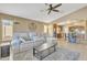 Cozy living room flows to the kitchen, with comfortable seating and ample natural light at 2910 E Quiet Hollow Ln, Phoenix, AZ 85024