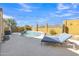 Private pool and backyard featuring desert landscaping and string lights, ideal for entertaining at 2910 E Quiet Hollow Ln, Phoenix, AZ 85024