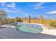 Sparkling blue tiled pool, perfect for relaxation with desert views and a secure fence at 2910 E Quiet Hollow Ln, Phoenix, AZ 85024