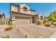 Charming two-story home featuring a tile roof and brick driveway at 3668 E Ficus Way, Gilbert, AZ 85298