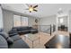 Living room featuring a comfortable sofa, a ceiling fan, and staircase at 3668 E Ficus Way, Gilbert, AZ 85298