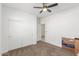 Minimalist bedroom with a closet, and a sliding door and a Chewy box at 38145 W Amalfi Ave, Maricopa, AZ 85138