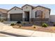 Charming single-story home with a two-car garage and a well-maintained desert landscape at 38145 W Amalfi Ave, Maricopa, AZ 85138