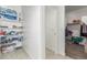 Organized storage with shelving, offering ample space for household items and personal belongings at 38145 W Amalfi Ave, Maricopa, AZ 85138