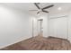 Neutral bedroom with a ceiling fan, closet and an ensuite bathroom at 4037 S Taylor Dr, Tempe, AZ 85282