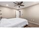 Bright bedroom featuring neutral tones, ceiling fan, and ensuite access at 4037 S Taylor Dr, Tempe, AZ 85282