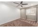 Bright bedroom with ceiling fan and a window for natural light at 4037 S Taylor Dr, Tempe, AZ 85282