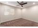 Minimalist bedroom with neutral tones, ceiling fan and a bright window at 4037 S Taylor Dr, Tempe, AZ 85282