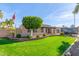 Inviting single-story home featuring a lush green lawn and mature trees at 4037 S Taylor Dr, Tempe, AZ 85282