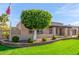 Inviting single-story home featuring a lush green lawn and mature trees at 4037 S Taylor Dr, Tempe, AZ 85282