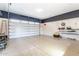 A clean garage with epoxy floors, overhead lighting, and plenty of space for storage and vehicles at 4037 S Taylor Dr, Tempe, AZ 85282