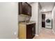 A modern laundry room featuring a granite countertop, laundry sink, and a washer and dryer at 4037 S Taylor Dr, Tempe, AZ 85282