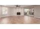 Bright living room featuring tile flooring, fireplace, ceiling fan and sliding glass door access to the backyard at 4037 S Taylor Dr, Tempe, AZ 85282