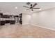 Spacious living room leading into the kitchen featuring tile flooring, ceiling fan and recessed lighting at 4037 S Taylor Dr, Tempe, AZ 85282