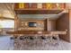 A bar with seating in an outdoor kitchen with a grill, TV, and plenty of space for entertaining at 4037 S Taylor Dr, Tempe, AZ 85282