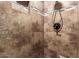 Tiled shower featuring a handheld shower head and tiled wall design at 4037 S Taylor Dr, Tempe, AZ 85282