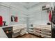 Walk-in closet with custom shelving and drawers offering ample storage space at 40930 N Lambert Trl, Phoenix, AZ 85086