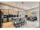 Spacious kitchen featuring stainless steel appliances, granite countertops, and a large island with seating at 40930 N Lambert Trl, Phoenix, AZ 85086