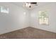 An empty bedroom features carpet flooring and bright natural light at 4428 E Wildhorse Dr, Gilbert, AZ 85297