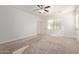 An empty bedroom includes neutral carpet and lots of bright natural light at 4428 E Wildhorse Dr, Gilbert, AZ 85297