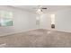 An empty bedroom offers bright natural light and neutral carpet flooring at 4428 E Wildhorse Dr, Gilbert, AZ 85297