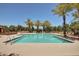 Inviting community pool surrounded by palm trees and lounge chairs at 4428 E Wildhorse Dr, Gilbert, AZ 85297