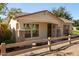 Attractive single-story home with desert landscaping, a welcoming front porch, and charming wood accents at 4428 E Wildhorse Dr, Gilbert, AZ 85297