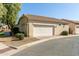 Attached two-car garage with mature landscaping and paver driveway at 4428 E Wildhorse Dr, Gilbert, AZ 85297