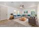 Bright living room featuring neutral decor, comfortable seating, ceiling fan, and ample natural light at 4428 E Wildhorse Dr, Gilbert, AZ 85297