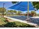 Community playground with a sun shade, climbing equipment, swings, and a bench at 4428 E Wildhorse Dr, Gilbert, AZ 85297