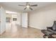 Spacious bedroom featuring neutral walls, tile flooring, and an open doorway at 445 W Gary Ave, Gilbert, AZ 85233