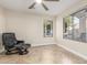 Cozy bedroom area with natural light, tile floors, and comfortable chair at 445 W Gary Ave, Gilbert, AZ 85233