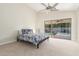 Cozy bedroom featuring a ceiling fan and sliding glass doors with a view of the private pool at 445 W Gary Ave, Gilbert, AZ 85233