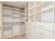 Spacious walk-in closet with custom shelving and drawers providing ample storage at 445 W Gary Ave, Gilbert, AZ 85233