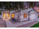 Home featuring manicured lawn, desert landscaping, and covered porch at 445 W Gary Ave, Gilbert, AZ 85233