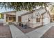Inviting front exterior with landscaped yard and covered entry at 445 W Gary Ave, Gilbert, AZ 85233