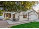 Inviting front exterior with manicured lawn, walkway, and desert landscaping at 445 W Gary Ave, Gilbert, AZ 85233