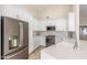 Modern kitchen featuring stainless steel appliances, marble backsplash, and white cabinetry for a clean, contemporary feel at 445 W Gary Ave, Gilbert, AZ 85233