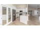 Modern white kitchen with stainless steel appliances and breakfast bar at 445 W Gary Ave, Gilbert, AZ 85233